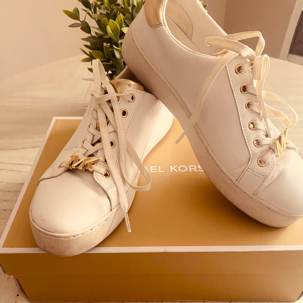 Michael Kors Size 8 white trimmed in gold tennis shoes.